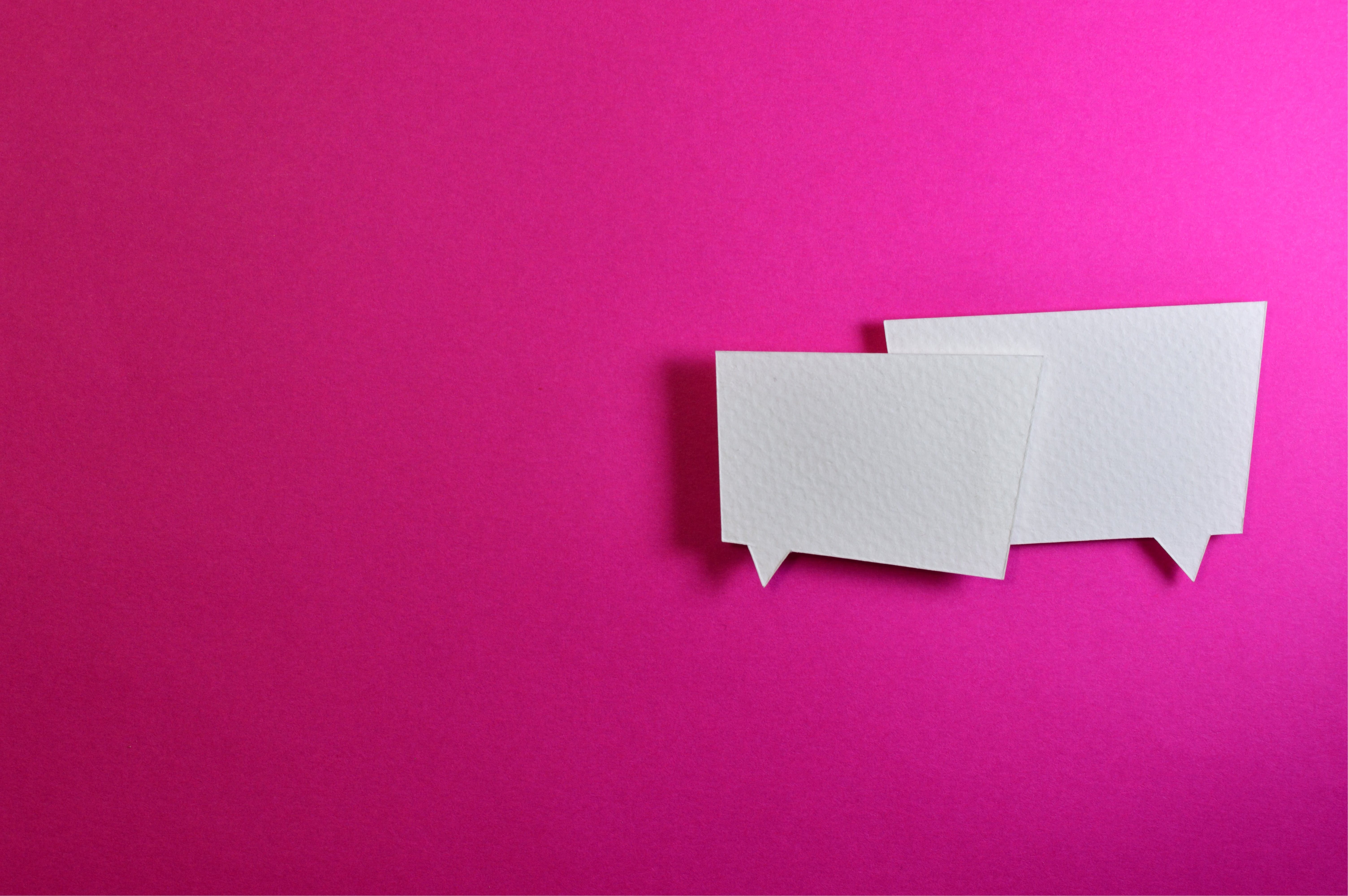 Decorative image of white speech bubbles on a bright background